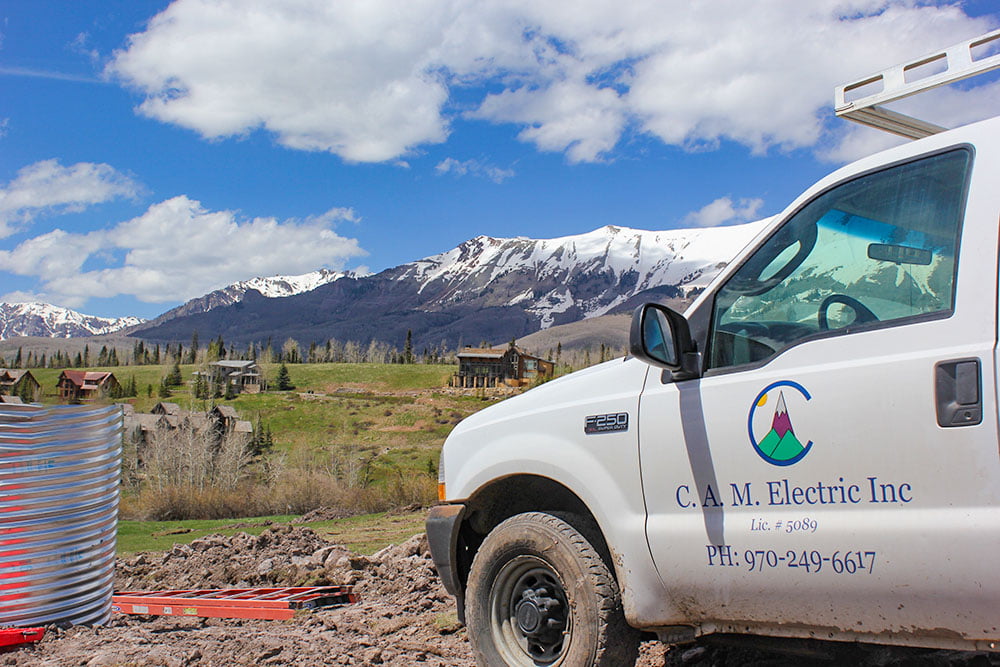 CAM Electric truck on-site with mountain views